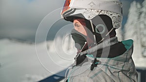 Person in ski clothes helmet and googles close up