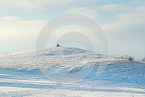 A person skillfully snowboards down a steep slope covered in fresh snow, surrounded by a wintry mountain landscape, Snowy hill