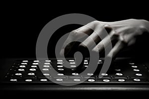A person skillfully types on a keyboard in the dark, highlighting their proficiency in the digital realm, A visually striking
