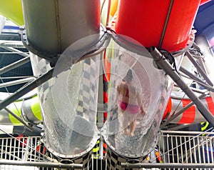 A Person sliding down a waterslide inside indoor waterpark photo