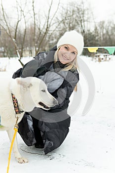 person snow adult outdoor friendship winter park dog animal husky season girl pet woman young