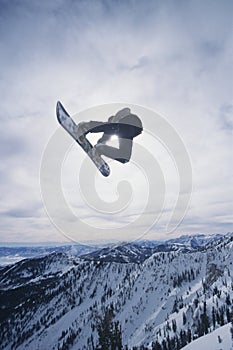 Person On Snowboard Jumping Midair