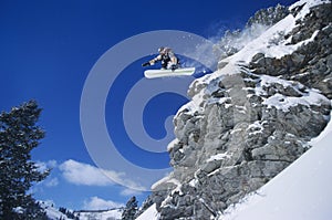 Person On Snowboard Jumping Midair photo