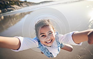 Person, spinning girl and pov at beach, portrait and smile for game, excited face and playing by sea in sunshine. Parent