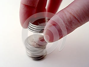 Person Stacking Coins