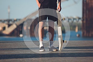 Person standing near skateboard.