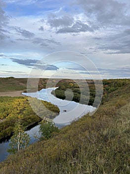 a person is standing on a rock in the middle of a river