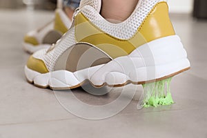 Person stepping into chewing gum on floor, closeup