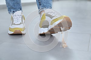 Person stepping into chewing gum on floor, closeup