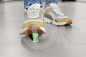 Person stepping into chewing gum on floor, closeup
