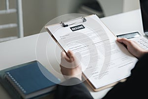 Person submitting resume to interview for a job with a company, Person attending a job interview with a manager to be recruited to