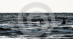 Person SUP foiling on a windy day..