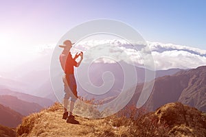 Person taking Photo Mountain Sunny Sky on Camera Phone