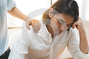 Person touching shoulder friend to encouragement