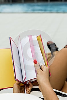Person turning pages of a book