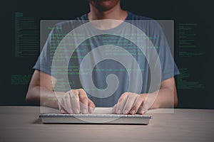 person typing code on a keyboard with a digital overlay, representing programming, software development, and cybersecurity in a