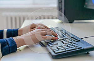 person typing on keyboard in ofice