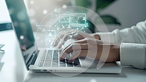 A person is typing on a laptop with a green screen showing a network of people