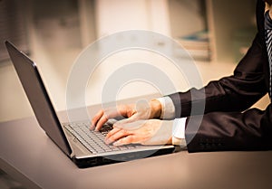 Person Typing on a modern laptop