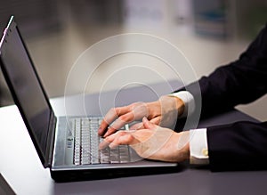 Person Typing on a modern laptop