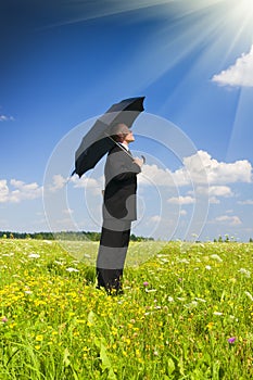 The person with an umbrella