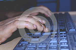 A person using a computer keyboard.