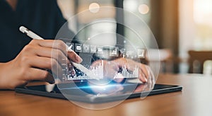 Person using digital tablet with stylus and glowing data visualization