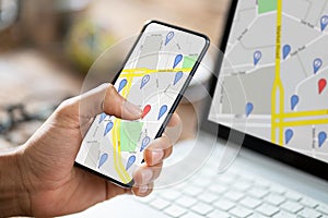 Person Using GPS Navigation Map On Mobile Phone