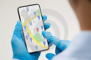 Person Using GPS Navigation Map On Mobile Phone