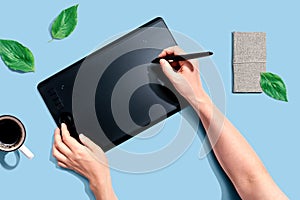 Person using a graphic pen tablet