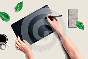 Person using a graphic pen tablet