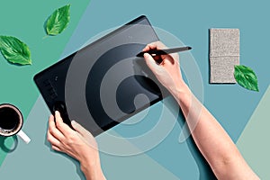 Person using a graphic pen tablet