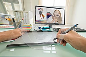 Person using graphic tablet for sketching