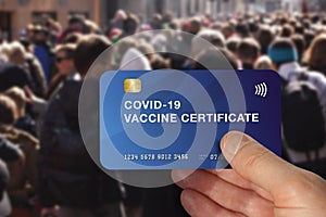 Person using health vaccine immunity card for restaurant visits, shopping or travel during Covid-19 pandemic. photo