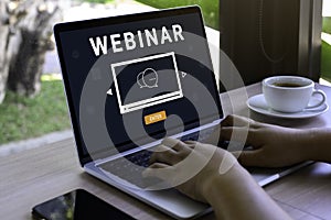 Person using a laptop computer for online training webinars. E-learning browsing connection and cloud online technology webcast