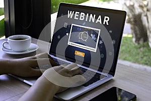 Person using a laptop computer for online training webinars. E-learning browsing connection and cloud online technology webcast