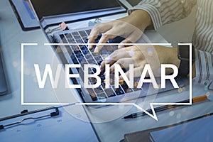 Person using a laptop computer for online training webinars. E-learning browsing connection and cloud online technology webcast