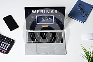 Person using a laptop computer for online training webinars. E-learning browsing connection and cloud online technology webcast
