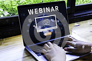 Person using a laptop computer for online training webinars. E-learning browsing connection and cloud online technology webcast