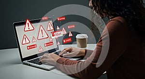 A person is using a laptop, displaying numerous red warning alerts overlayed on photo