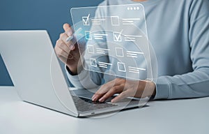 Person using laptop and interacting with virtual checklist interface