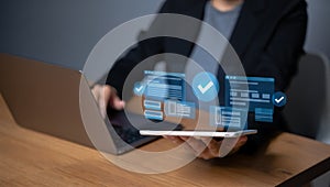 Person using laptop and tablet with digital approval workflow interface digital workflow