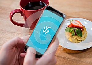 Person using Phone with Shopping trolley icon