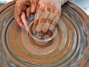 Person using potters wheel photo