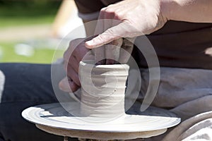 Person using potters wheel photo