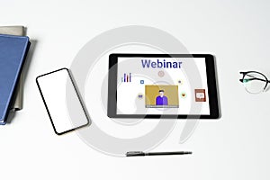 Person using a tablet computer for online training webinars.