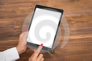 Person using tablet with empty blank screen, vertical orientation photo