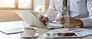 Person using a tablet to explore interactive data visualizations with colorful graphs and charts in a contemporary setting