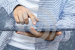 Person using a tablet in web cyberspace for cyber criminal.