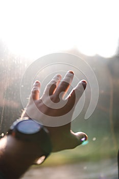 Person using watch. Young man young man riding a bus on the road looking out the window. travel concept, vertical
